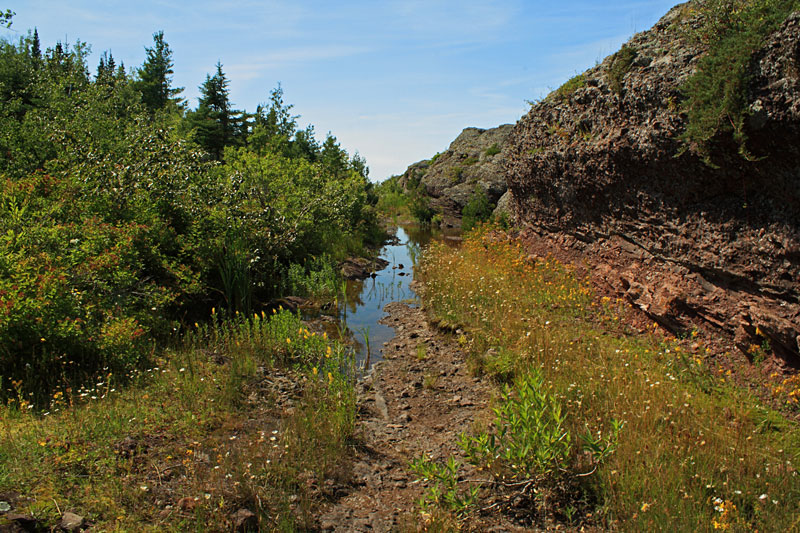 water over the trail at horseshoe harbor